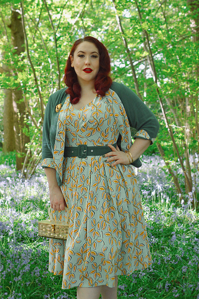 Plus size pinup Miss Amy May models the Kimmie-gia dress and Samira-Gia jacket by Miss Candyfloss for a fit and size freview