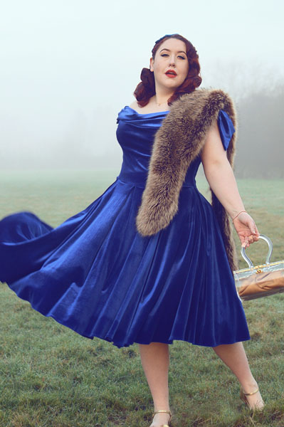 Plus size pinup Miss Amy May models the Sapphire Velvet Tilly Bow Prom swing dress by The Pretty Dress Company for a fit and size review