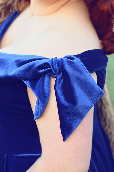 Plus size pinup Miss Amy May models the Sapphire Velvet Tilly Bow Prom swing dress by The Pretty Dress Company for a fit and size review