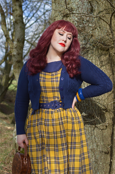 Plus size pinup Miss Amy May models the yellow and navy tartan Cindy circle skirt dress gifted by Dolly & Dotty for a fit and sizing review