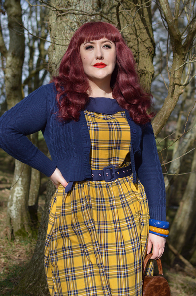 Plus size pinup Miss Amy May models the yellow and navy tartan Cindy circle skirt dress gifted by Dolly & Dotty for a fit and sizing review