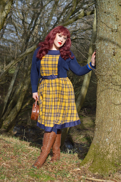 Plus size pinup Miss Amy May models the yellow and navy tartan Cindy circle skirt dress gifted by Dolly & Dotty for a fit and sizing review