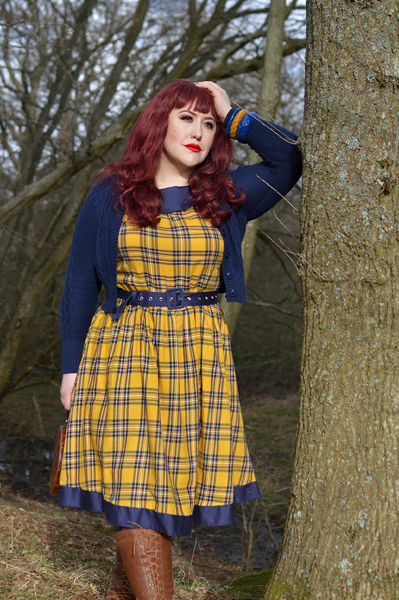 Plus size pinup Miss Amy May models the yellow and navy tartan Cindy circle skirt dress gifted by Dolly & Dotty for a fit and sizing review