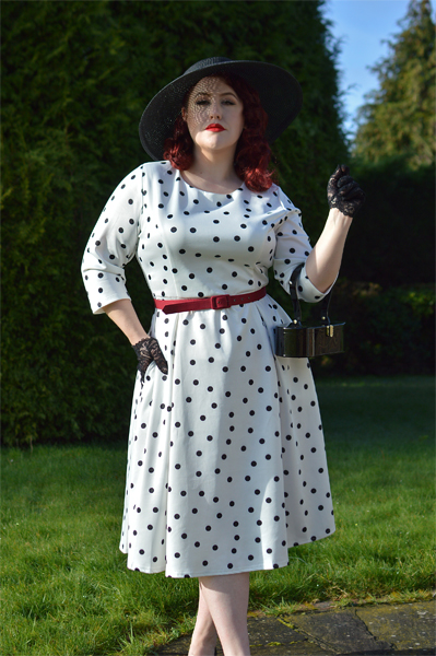 Plus size pinup Miss Amy May models the Black and white Polka dot Janet Beatrix dress by Dolly & Dotty for a fit and size review