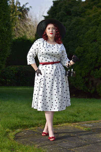 Plus size pinup Miss Amy May models the Black and white Polka dot Janet Beatrix dress by Dolly & Dotty for a fit and size review