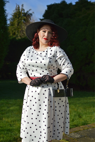 Plus size pinup Miss Amy May models the Black and white Polka dot Janet Beatrix dress by Dolly & Dotty for a fit and size review