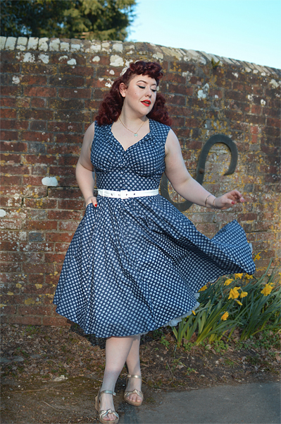 Plus size pinup Miss Amy May models the Khloe-Lee dress and Lizia-Lee Lydia-Lee blazer by Miss Candyfloss for a fit and size reciew
