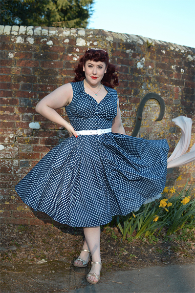Plus size pinup Miss Amy May models the Khloe-Lee dress and Lizia-Lee Lydia-Lee blazer by Miss Candyfloss for a fit and size reciew