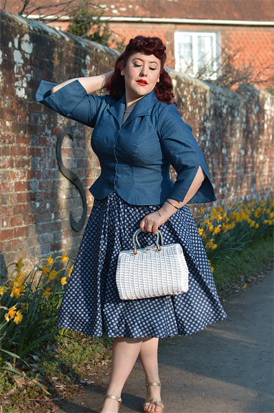 Plus size pinup Miss Amy May models the Khloe-Lee dress and Lizia-Lee Lydia-Lee blazer by Miss Candyfloss for a fit and size reciew