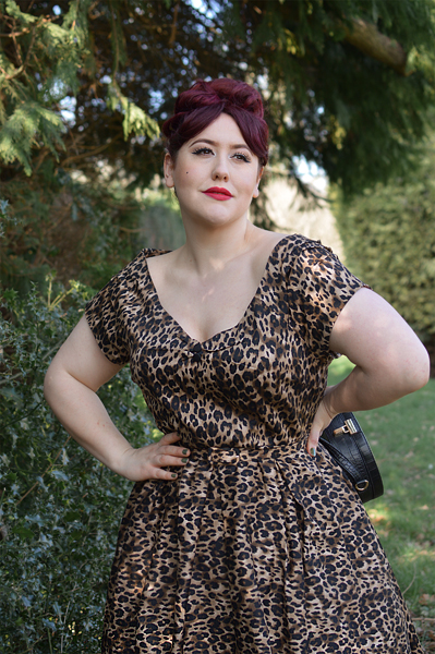 Plus size pinup Miss Amy May models the leopard print off the shoulder Lily dress by Dolly & Dotty for a fit and size review