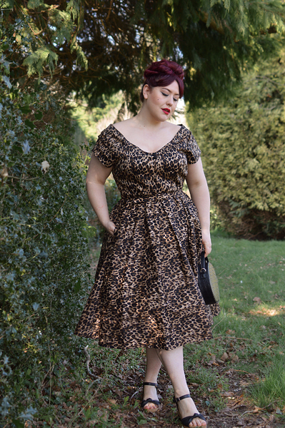 Plus size pinup Miss Amy May models the leopard print off the shoulder Lily dress by Dolly & Dotty for a fit and size review
