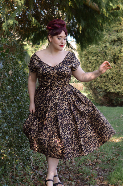 Plus size pinup Miss Amy May models the leopard print off the shoulder Lily dress by Dolly & Dotty for a fit and size review