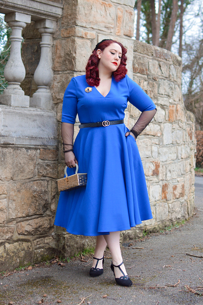 Plus size pinup Miss Amy May models the Myla dress in cobalt blue by The Pretty Dress Company for a fit and size review