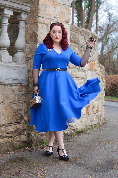 Plus size pinup Miss Amy May models the Myla dress in cobalt blue by The Pretty Dress Company for a fit and size review