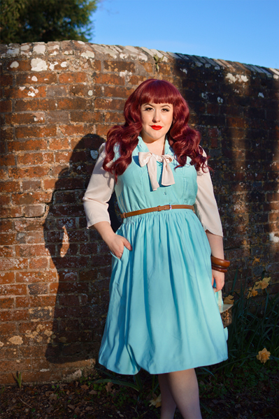 Plus size pinup Miss Amy May models the Cry-Baby dress by Hell Bunny for a fit and size review