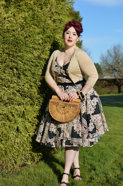 Plus size pinup Miss Amy May models the Dominique 50s dress by Hell Bunny for a fit and size review