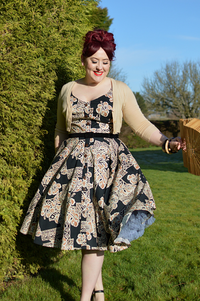 Plus size pinup Miss Amy May models the Dominique 50s dress by Hell Bunny for a fit and size review