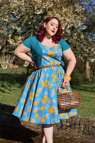 Plus size pinup Miss Amy May models the Valencia 50s dress by Hell Bunny for fit and size review