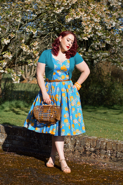 Plus size pinup Miss Amy May models the Valencia 50s dress by Hell Bunny for fit and size review