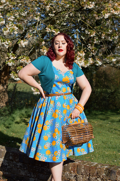 Plus size pinup Miss Amy May models the Valencia 50s dress by Hell Bunny for fit and size review