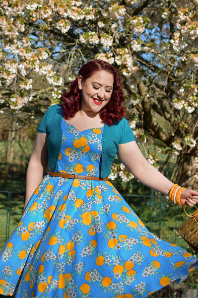Plus size pinup Miss Amy May models the Valencia 50s dress by Hell Bunny for fit and size review