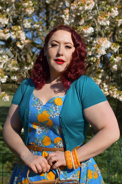 Plus size pinup Miss Amy May models the Valencia 50s dress by Hell Bunny for fit and size review