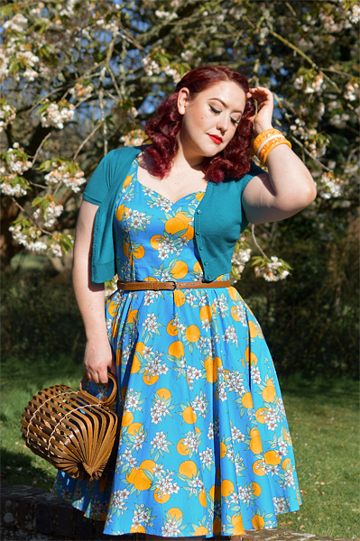 Plus size pinup Miss Amy May models the Valencia 50s dress by Hell Bunny for fit and size review