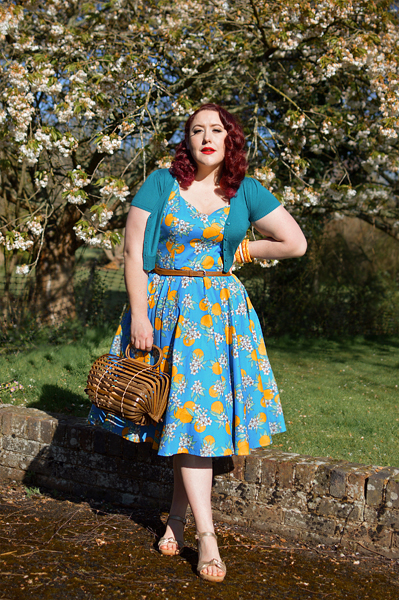 Plus size pinup Miss Amy May models the Valencia 50s dress by Hell Bunny for fit and size review