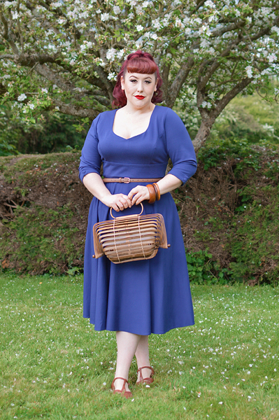 Plus size pinup Miss Amy May models the navy Scarlette dress by Dolly and Dotty for a fit and sizing review
