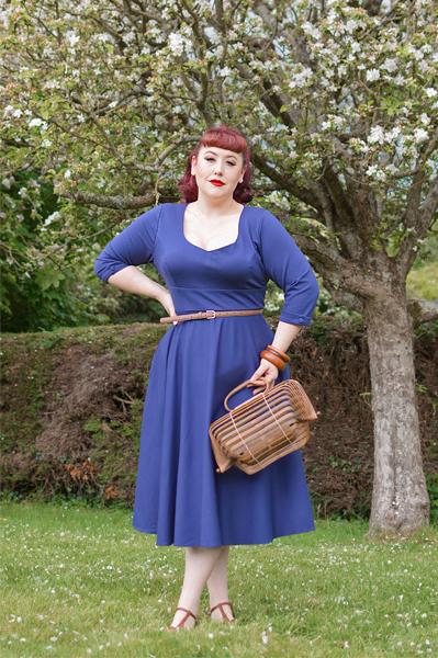 Plus size pinup Miss Amy May models the navy Scarlette dress by Dolly and Dotty for a fit and sizing review