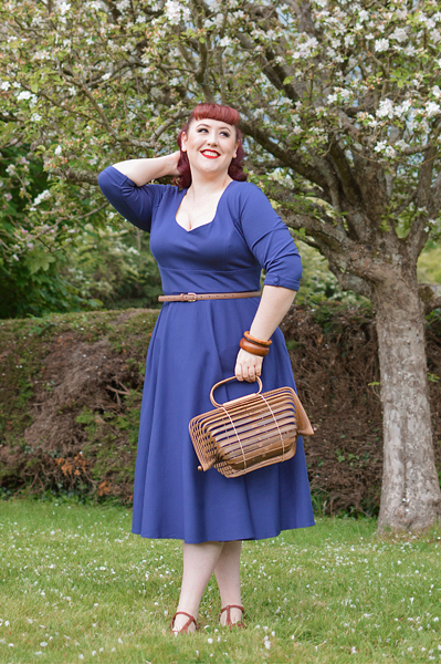 Plus size pinup Miss Amy May models the navy Scarlette dress by Dolly and Dotty for a fit and sizing review