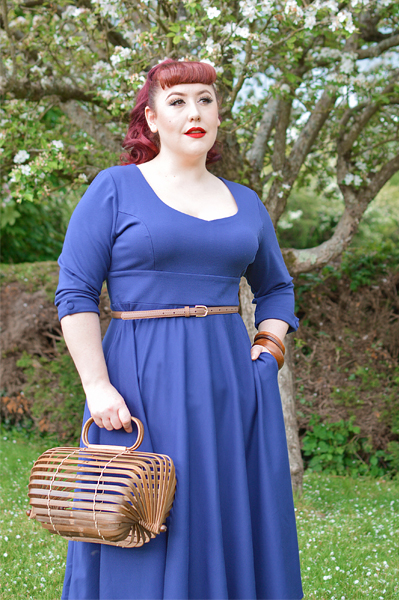 Plus size pinup Miss Amy May models the navy Scarlette dress by Dolly and Dotty for a fit and sizing review