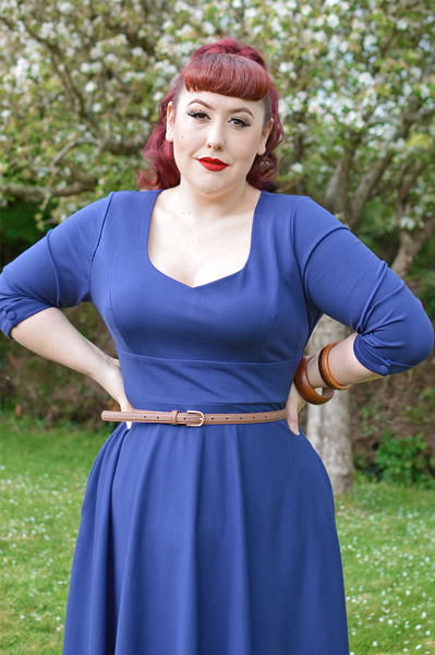 Plus size pinup Miss Amy May models the navy Scarlette dress by Dolly and Dotty for a fit and sizing review