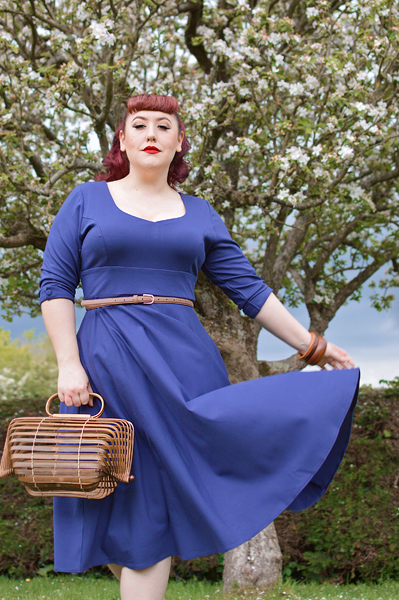 Plus size pinup Miss Amy May models the navy Scarlette dress by Dolly and Dotty for a fit and sizing review