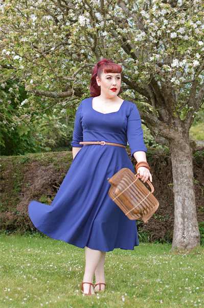 Plus size pinup Miss Amy May models the navy Scarlette dress by Dolly and Dotty for a fit and sizing review