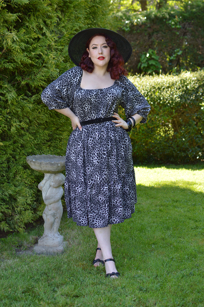Plus size pinup Miss Amy May models the Sonia floaty Day Dress in Grey leopard animal print by Dolly and Dotty for a fit and size review