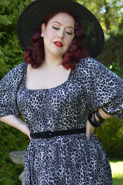 Plus size pinup Miss Amy May models the Sonia floaty Day Dress in Grey leopard animal print by Dolly and Dotty for a fit and size review