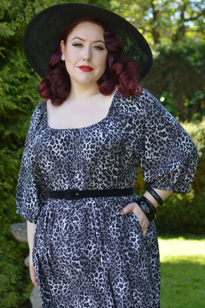 Plus size pinup Miss Amy May models the Sonia floaty Day Dress in Grey leopard animal print by Dolly and Dotty for a fit and size review