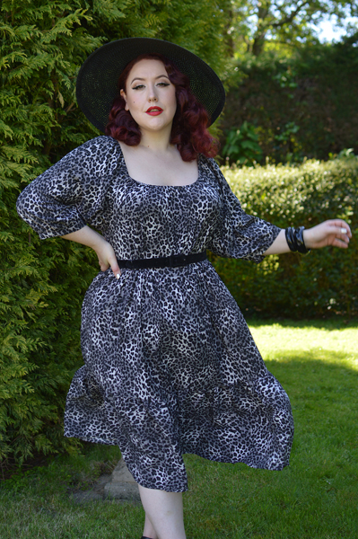 Plus size pinup Miss Amy May models the Sonia floaty Day Dress in Grey leopard animal print by Dolly and Dotty for a fit and size review