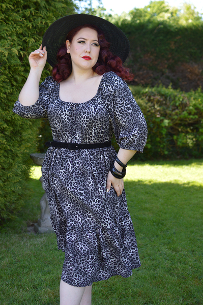 Plus size pinup Miss Amy May models the Sonia floaty Day Dress in Grey leopard animal print by Dolly and Dotty for a fit and size review