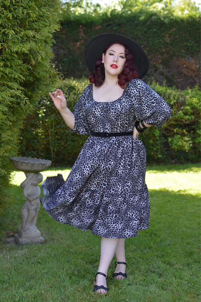 Plus size pinup Miss Amy May models the Sonia floaty Day Dress in Grey leopard animal print by Dolly and Dotty for a fit and size review