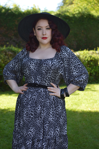 Plus size pinup Miss Amy May models the Sonia floaty Day Dress in Grey leopard animal print by Dolly and Dotty for a fit and size review