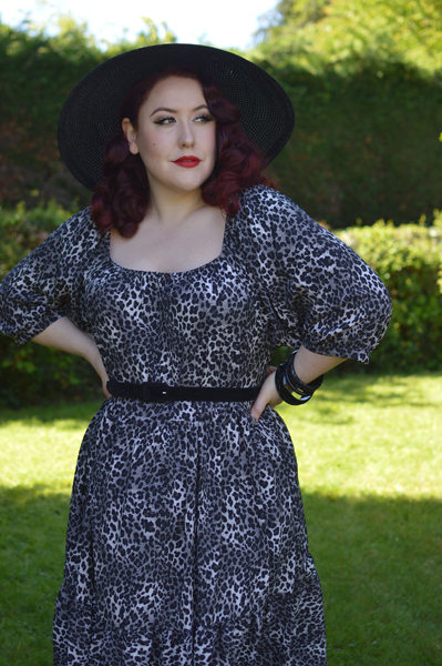 Plus size pinup Miss Amy May models the Sonia floaty Day Dress in Grey leopard animal print by Dolly and Dotty for a fit and size review