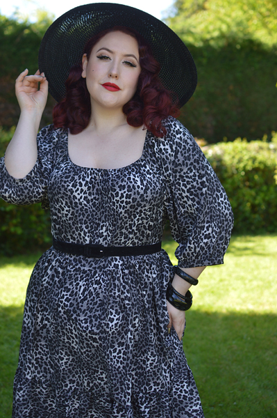 Plus size pinup Miss Amy May models the Sonia floaty Day Dress in Grey leopard animal print by Dolly and Dotty for a fit and size review