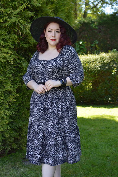 Plus size pinup Miss Amy May models the Sonia floaty Day Dress in Grey leopard animal print by Dolly and Dotty for a fit and size review