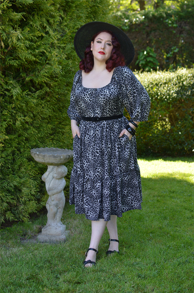 Plus size pinup Miss Amy May models the Sonia floaty Day Dress in Grey leopard animal print by Dolly and Dotty for a fit and size review
