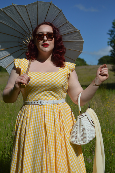 Plus size pinup Miss Amy May models the Elsie yellow gingham swing dress by The Pretty Dress company for a fit and size review