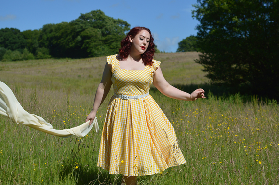 Plus size pinup Miss Amy May models the Elsie yellow gingham swing dress by The Pretty Dress company for a fit and size review
