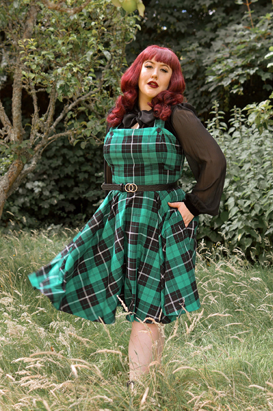 Plus size pinup Miss Amy May models the Beryl pinafore dress by Hell Bunny for a fit and sizing review