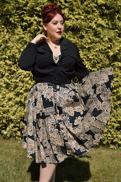 Plus size pinup Miss Amy May models the Ravenwood jackets by Hell Bunny for a fit and sizing review